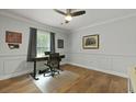 Cozy home office featuring hardwood floors, gray walls, and a ceiling fan at 96 King Charles Cir, Summerville, SC 29485