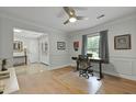 Spacious home office with hardwood floors, light gray walls, and a view of the yard at 96 King Charles Cir, Summerville, SC 29485