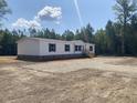 This charming manufactured home offers a cozy and inviting curb appeal at 1010 Universal Cir, Saint Stephen, SC 29479