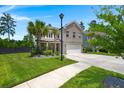 Charming two-story brick home with well-maintained landscaping, a driveway, and a two-car garage at 106 Claremont Ct, Summerville, SC 29486
