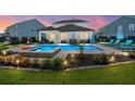 Inviting backyard oasis featuring a sparkling pool, comfortable lounge chairs, and an outdoor seating area at 106 Claremont Ct, Summerville, SC 29486