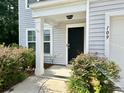 Welcoming entrance features an elegant black door and lovely landscaping at 109 Rosefield Ct, Summerville, SC 29485