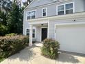 Charming home featuring a well-maintained lawn, attached garage, and classic light-grey siding at 109 Rosefield Ct, Summerville, SC 29485