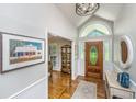 Welcoming entryway featuring a decorative rug, beautiful hardwood floors, and a wooden front door with sidelights at 1098 Blue Marlin Dr, Charleston, SC 29412