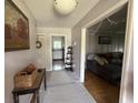 Welcoming entryway with neutral tones, a hallway and views to a kitchen and a living room at 1139 Belvedere Dr, Hanahan, SC 29410