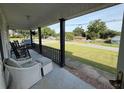 Relax on the front porch with classic rocking chairs and a view of the peaceful neighborhood street at 1139 Belvedere Dr, Hanahan, SC 29410