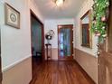 Welcoming foyer with hardwood floors, decorative accents, and traditional wainscoting, providing a warm entry at 14 Ashland Dr, Charleston, SC 29407