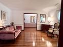 Elegant living room with hardwood floors, traditional trim, and ample space for entertaining guests at 14 Ashland Dr, Charleston, SC 29407