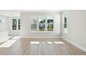 Bright living room with multiple windows, flooding the space with natural light at 185 Queenview Ln, Charleston, SC 29414