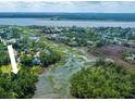 Breathtaking aerial view showcasing the homes location with amazing waterfront access and lush green surroundings at 1971 N North Creek Dr, Mount Pleasant, SC 29466