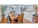 Bright dining area featuring a wood table and easy access to the modern kitchen at 2011 N Highway 17 # 1900G, Mount Pleasant, SC 29466