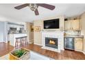 Inviting living room featuring a cozy fireplace, ceiling fan, and hardwood flooring at 2011 N Highway 17 # 1900G, Mount Pleasant, SC 29466