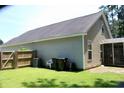Low-maintenance backyard featuring verdant lawn, privacy fence, and mature trees at 207 Short Woods Ct, Summerville, SC 29486