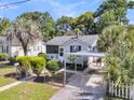 Charming single-story home with a well-maintained lawn, mature trees, and convenient covered parking at 2215 Suffolk St, North Charleston, SC 29405