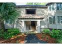 Exterior entrance of a condo featuring stairs, siding, and a palm tree at 4856 Green Dolphin Way # Share 6, Kiawah Island, SC 29455