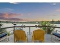 Relax on the deck with comfortable seating and enjoy breathtaking water views at 4940 Lambs Rd, North Charleston, SC 29418