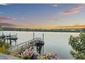 Picturesque waterfront view featuring a private dock and peaceful surroundings at 4940 Lambs Rd, North Charleston, SC 29418