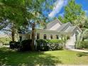 Inviting single-story home featuring well-maintained landscaping and classic architectural details at 5079 Coral Reef Dr, Johns Island, SC 29455