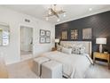 Beautiful bedroom with accent wall, modern chandelier, and light neutral color scheme at 552 Scholar Way, Summerville, SC 29486