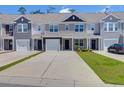 Charming townhomes with private driveways, manicured lawns, and inviting curb appeal at 715 Hilchot Dr, Summerville, SC 29486