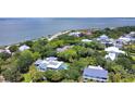 Picturesque neighborhood with mature trees offers a beautiful home with a private pool and stunning ocean views at 932 Middle St, Sullivans Island, SC 29482