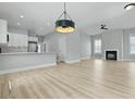 Modern living room with open floor plan to kitchen with stainless appliances at 104 Brightwood Dr, Huger, SC 29450