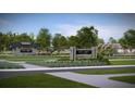 Community entrance sign surrounded by beautiful landscaping and mature trees at 109 Barker Street, Summerville, SC 29486