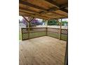 Lovely covered back porch with lattice-work, and a view of the backyard at 109 Dovetail Cir, Summerville, SC 29483