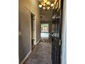 Inviting entryway with tile flooring leading to wood floors and sliding glass doors at 109 Dovetail Cir, Summerville, SC 29483
