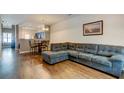 Cozy living room area, showing a sectional sofa, dining table, and kitchen at 143 Dorothy Dr, Charleston, SC 29414