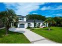 This home has a wide driveway and manicured green front yard at 1468 N Relyea Ave, Charleston, SC 29412
