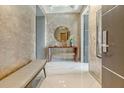 Inviting entryway with marble floors, a stylish console table and mirror for a modern elegant touch at 149 Cooper River Dr, Mount Pleasant, SC 29464
