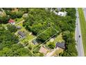 Aerial view of a wooded lot featuring a single-Gathering home near a highway at 1879 Richmond St, Charleston, SC 29407