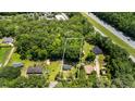 Areal view of a wooded lot with a home, near a highway and adjacent to other single Gathering residences at 1879 Richmond St, Charleston, SC 29407