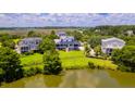 Beautiful two-story home with large lawn, overlooking a pond and near marsh at 2312 Rushland Landing Rd, Johns Island, SC 29455