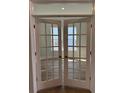 Elegant French doors with glass panels offering a view into a sunlit room at 235 Denham St, Summerville, SC 29486