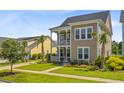 Beautiful two-story home with double porches and a well-maintained lawn at 357 Parish Farms Dr, Summerville, SC 29486