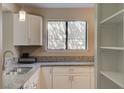 Kitchen features a large window, granite countertops, and stainless steel sink at 8483 Yadkin Cir # D, North Charleston, SC 29406