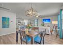 This dining area features an open floor plan with views to the living room and eat-in kitchen at 9700 Flooded Field Dr, Ladson, SC 29456