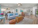 This home features an open floor plan with living room flowing seamlessly into dining area and kitchen at 9700 Flooded Field Dr, Ladson, SC 29456