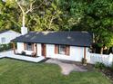 Overhead shot of updated home; new roof, white paint, beautiful yard and landscape and wooden shutters at 1129 Dickson Ave, Hanahan, SC 29410