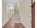 Elegant entryway with hardwood floors, staircase, and views into adjoining rooms at 1184 Dingle Rd, Mount Pleasant, SC 29466