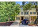 Inviting townhome exterior with a private garage and well-maintained front yard at 1184 Dingle Rd, Mount Pleasant, SC 29466