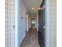 Inviting foyer featuring wood-look flooring and neutral paint, leading to various rooms of the home at 123 Lagoona Dr, Summerville, SC 29483