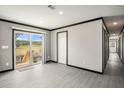 Inviting room with a slider to the outside, modern flooring, and neutral wall colors at 1326 Givhans Rd, Ridgeville, SC 29472