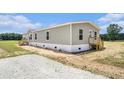 Charming single-story home featuring gray siding, white trim, and a welcoming back porch at 1332 Givhans Rd, Ridgeville, SC 29472
