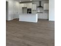 Open-concept kitchen with white cabinets and a center island at 124 Ireland Dr, Summerville, SC 29486