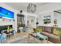 Elegant living room with a fireplace, stylish decor, and an open layout at 1682 Camfield Ln, Mount Pleasant, SC 29466