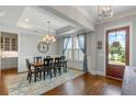 Dining room with hardwood floors, decorative rug, and modern chandelier at 1722 Trewin Ct, Charleston, SC 29492
