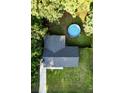 Aerial view of house, showing roof, manicured lawn, above ground pool, and treed perimeter at 214 E Edgefield Dr, Summerville, SC 29483